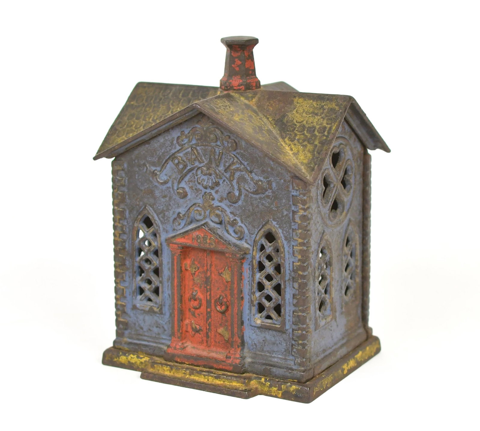 19TH C. CAST IRON STILL BANK.: A 19th C. cast iron still bank, bank building, dated 1882, in blue paint with yellow roof and red door. 6”H x 4”W x 3”D.