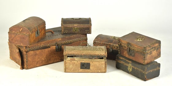 EIGHT 19TH C. LEATHER STUDDED BOXES.