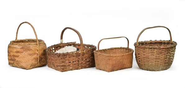 FOUR ANTIQUE SPLINT BASKETS WITH ANTIQUE BOOKS.
