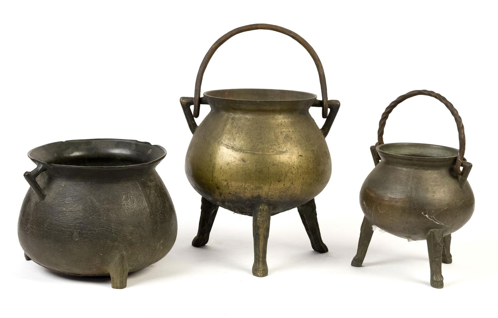 THREE EARLY BRONZE FOOTED KETTLES. (1 of 8)