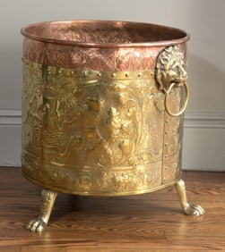 ANTIQUE BRASS AND COPPER FOOTED KINDLING BUCKET.