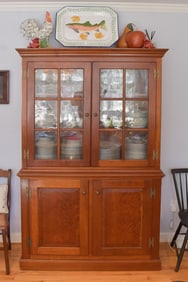 ELDRED WHEELER TWO-PART CHERRY CUPBOARD.