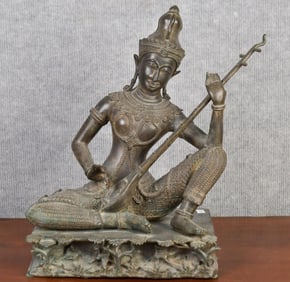 ANTIQUE THAI BRONZE SEATED DEITY.