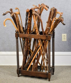 LARGE COLLECTION OF WALKING STICKS, WITH HOLDER.