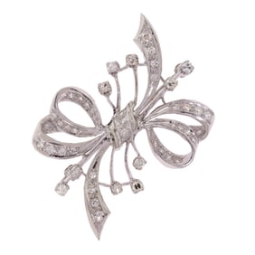 VINTAGE 14K GOLD BOW PIN W/ DIAMOND SPRAY.