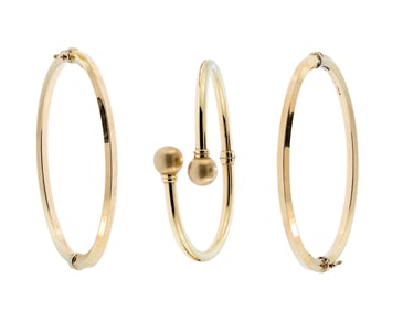 THREE 18K MILOR BRACELETS.