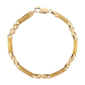 14K GOLD BRACELET W/ GOLD NUGGET LINKS.