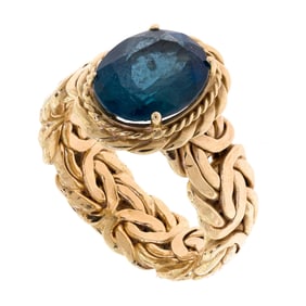 14K YELLOW GOLD BLUE TOPAZ RING.