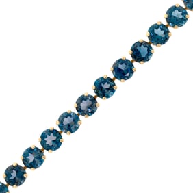 14K GOLD DARK BLUE TOPAZ BRACELET.