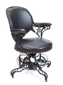 VICTORIAN CAST IRON AND LEATHER CHAIR.
