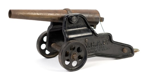 ANTIQUE CAST IRON WINCHESTER ARMS CANNON.