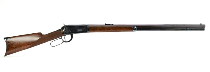 ANTIQUE WINCHESTER MOD 1894 DELUXE 25-35 CAL RIFLE.
