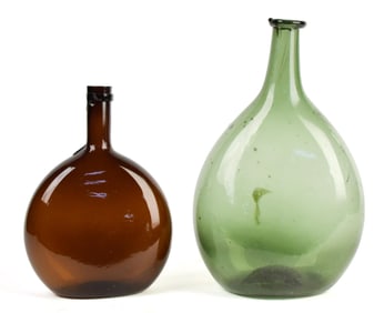TWO ANTIQUE OLIVE GREEN & AMBER CHESTNUT BOTTLES.