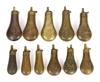 COLLECTION OF ANTIQUE BRASS POWDER FLASKS.