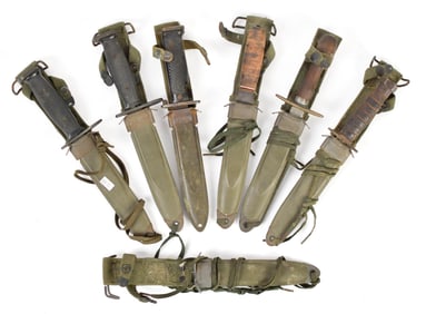 SIX MILITARY KNIVES WITH SHEATHS.