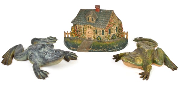 THREE CAST IRON DOOR STOPS.