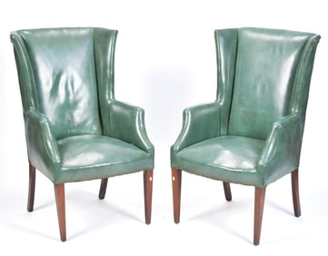 PAIR VINTAGE GREEN LEATHER WING CHAIRS.