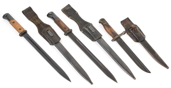 THREE VINTAGE BAYONETS WITH SHEATHS.