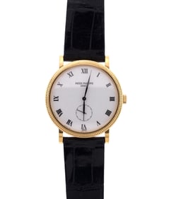 18K GOLD PATEK PHILIPPE CALATRAVA WRIST WATCH.