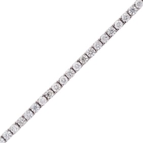 12 CT. TW. DIAMOND PLATINUM TENNIS BRACELET.