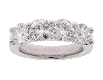 FOUR STONE 3.10 CT. TW. DIAMOND PLATINUM BAND.