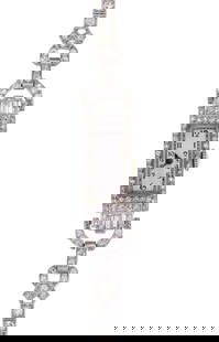 PLATINUM ART DECO DIAMOND LADY'S WRIST WATCH.: A platinum Art Deco lady's wrist watch set with approx. 3.5 ct. tw. round brilliant and baguette cut, natural diamonds of G-H-I color and VS-SI clarity, 32 x 10 mm case, monogram on reverse A.M.H., 17
