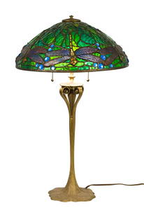 TIFFANY STUDIOS BRONZE LAMP BASE AND UNSIGNED SHADE.: A Tiffany Studios bronze table lamp base, with dore statuary finish, impressed on underside 'Tiffany Studios New York 641', retains original heat cap, pull chain sockets. Sold with an unsigned 20th C.