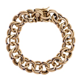 CIRCA 1970 14K GOLD 14 MM DOUBLE LINK CHARM BRACELET.