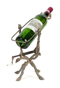 ENGLISH SILVERED BRONZE WINE CRADLE.