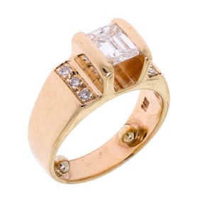 14K YELLOW GOLD .85 CT. EMERALD CUT DIAMOND RING.