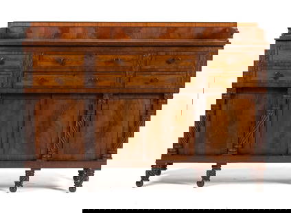 19TH C. VIRGINIA SHERATON MAHOGANY SIDEBOARD.: A ca. 1830 Sheraton mahogany sideboard, with carvings indicative of Norfolk Virginia workshops. Features a bookmatched veneered mahogany back splash, and a case with six drawers and four paneled doors