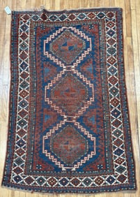 ANTIQUE KAZAK SCATTER RUG.