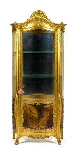 19TH C. FRENCH CARVED AND GILT CURIO CABINET.: A late 19th C. French Vernis Martin curio cabinet, with a carved and gilt case, and a scenic paint decorated door, 69”H x 30”W x 18”D.
