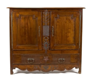 EARLY 19TH C. FRENCH CARVED WALNUT CUPBOARD.
