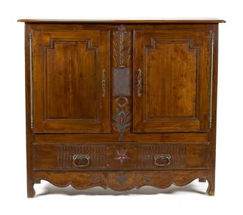 EARLY 19TH C. FRENCH CARVED WALNUT CUPBOARD.: A late 18th/early 19th C. French carved walnut court cupboard with double paneled doors, and a floral carved central frieze, over a single full length drawer. 52”H x 59”W x 20.5”D.