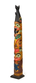 NORTHWEST COAST CARVED TOTEM POLE.