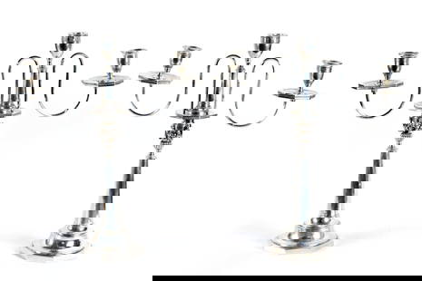 PR. DAVID GOTTLIEB RAUDNER SILVER CANDELABRAS.: An antique pair of German silver candelabras with makers mark DGR (David Gottlieb Raudner), each with three candle sockets, the removable upper arms are supported by tapered columns, on octagonal base
