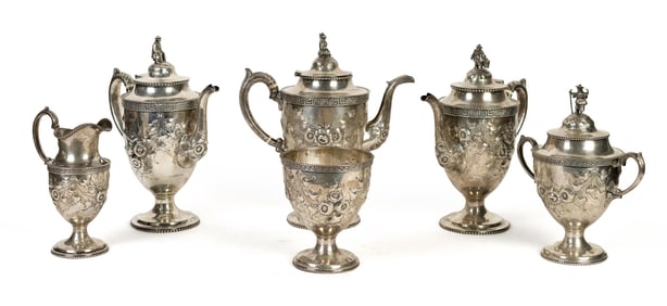 ANTIQUE SIX PIECE SILVER TEA SET.