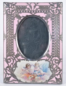 STERLING OVERLAY PORCELAIN FRAME.