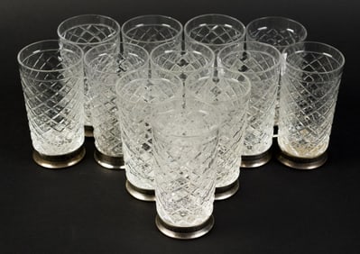 TWELVE RUSSIAN SILVER AND CUT GLASS VODKA GLASSES.