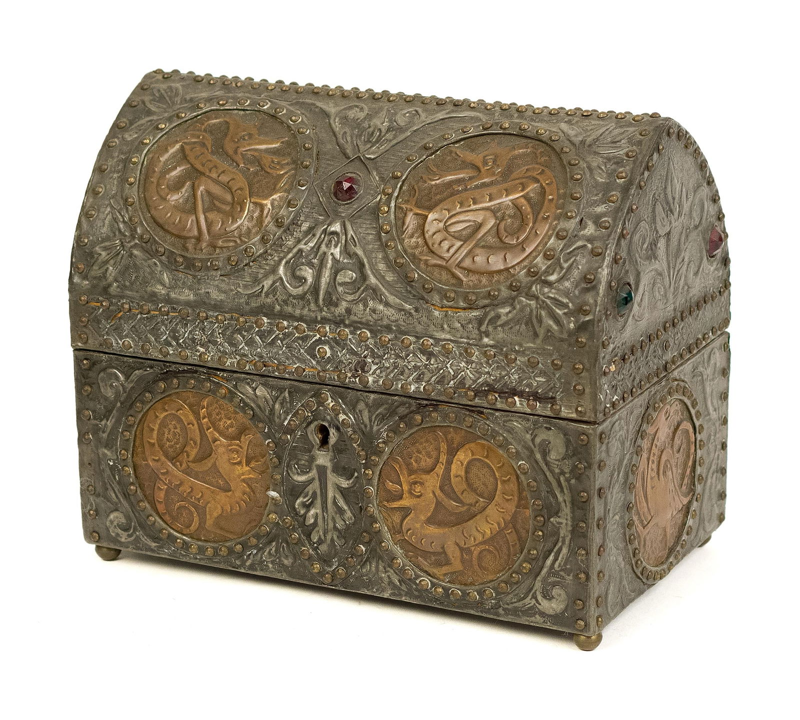 AFTER ALFRED DAGUET MIXED METAL JEWELRY CASKET.: An antique embossed pewter and copper jewelry casket with a hinged top that reveals a fabric lined interior, exterior with dragon and embedded cut glass crystals, in the manner of Alfred Daguet (unsig