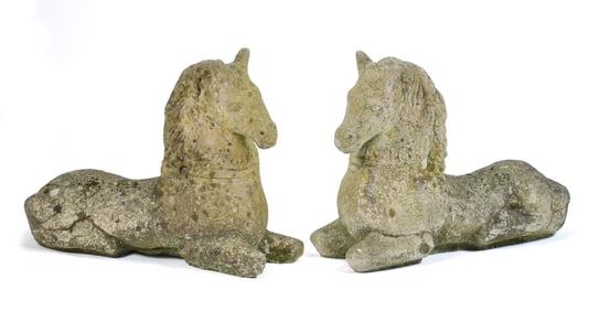 PAIR STONE RECUMBENT HORSES GARDEN ORNAMENTS.