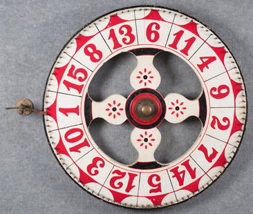 ANTIQUE PAINTED WOOD GAME WHEEL.: An antique painted wood and metal game wheel, in red, white, and blue paint, with wall mount and leather indicator. 32” dia.
