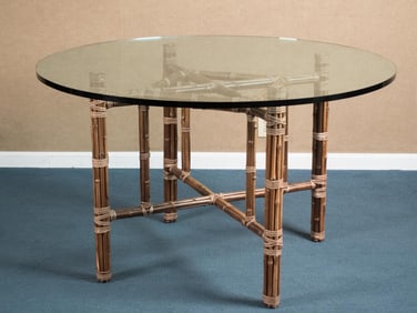MCGUIRE BAMBOO AND RATTAN GLASS TOP DINING TABLE.