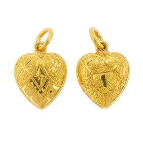 TWO THAI 23K GOLD PUFFED HEART CHARMS.