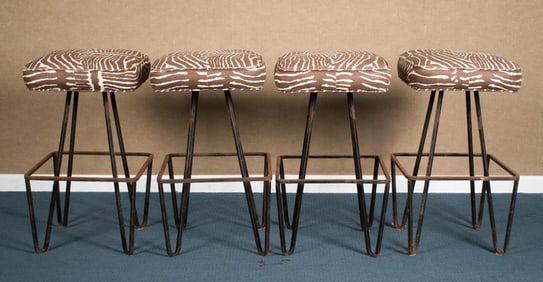 FOUR VINTAGE IRON BAR STOOLS.