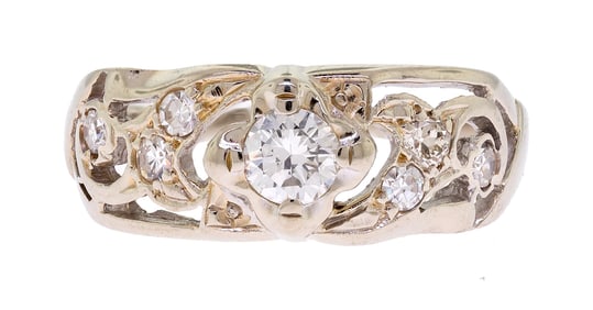 VINTAGE 14K WHITE GOLD PIERCED DIAMOND RING.