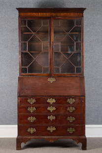 18TH C. MA CHIPPENDALE MAHOGANY SECRETARY.: A ca. 1780 Boston MA area Chippendale secretary, with a nicely inlaid molded cornice, over two sectional glass doors covering two adjustable wood shelves. The bottom section with a slant lid opening t