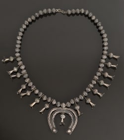 ANTIQUE SILVER NATIVE AMERICAN SQUASH BLOSSOM.