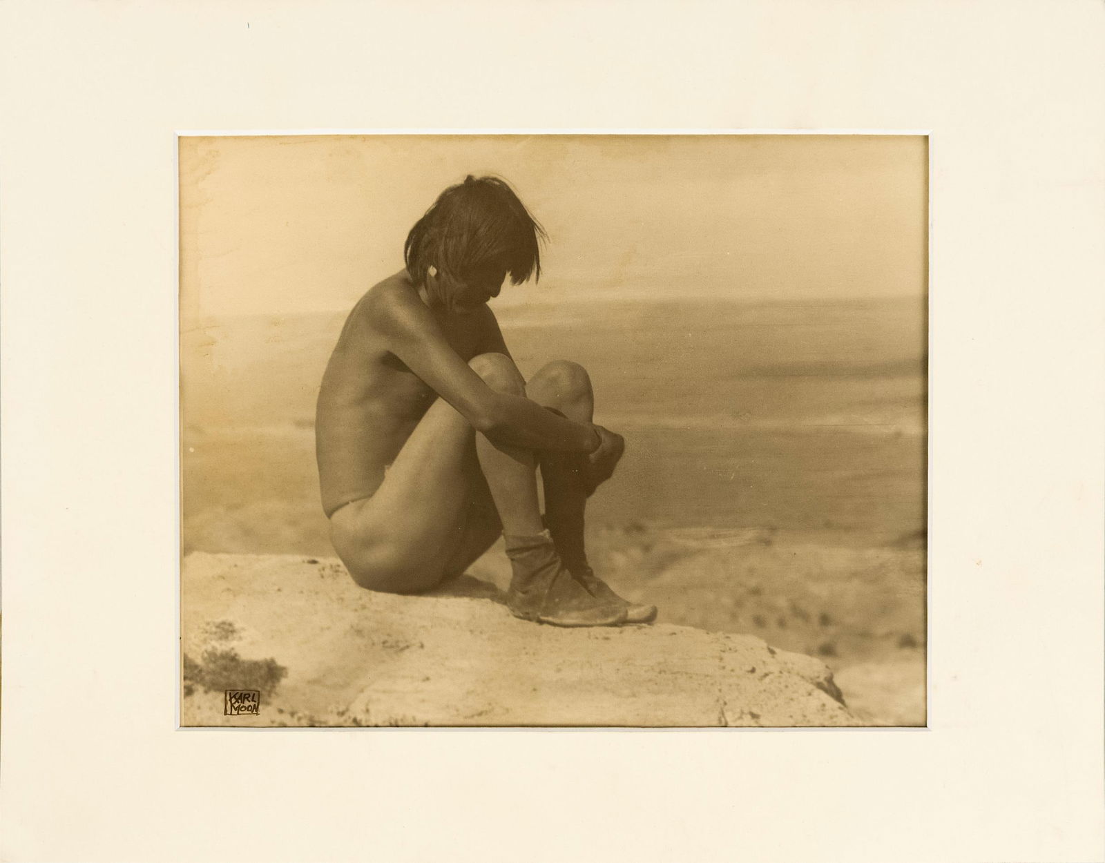 CARL MOON PHOTOGRAPH, ‘LAST OF HIS TRIBE’.: A Carl Moon (1879-1948) sepia tone photograph, “The Last of His People”, signed in ink lower left, Karl Moon. Along with appraisal by Carl Driebe, Carl Moon specialist. Paper size 8”